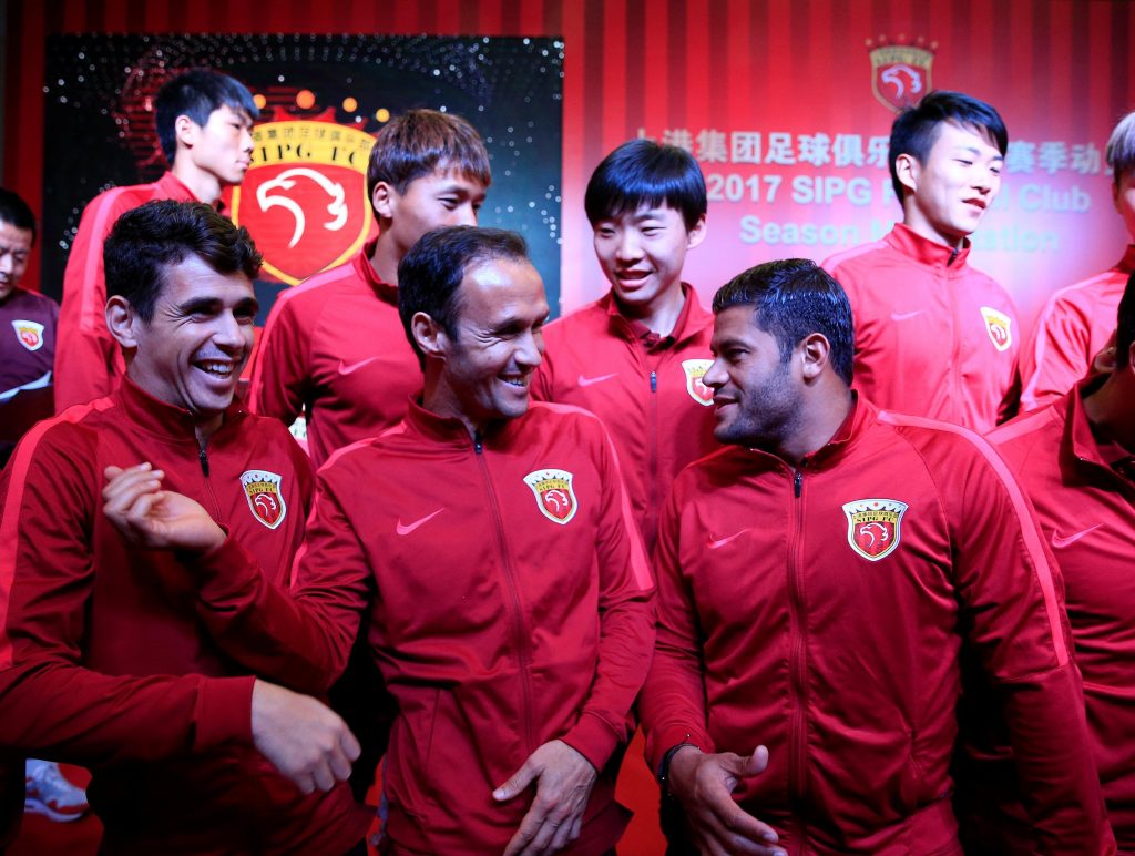 Brazilian soccer players Oscar (front, L) and Hulk (front, R) and Portuguese soccer player Ricardo Carvalho (front, C) attend the 2017 SIPG Football Club's season mobilization of the Chinese Super League, in Shanghai, China February 13, 2017. REUTERS/Aly Song